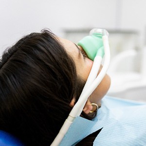 Woman relaxing while breathing in nitrous oxide