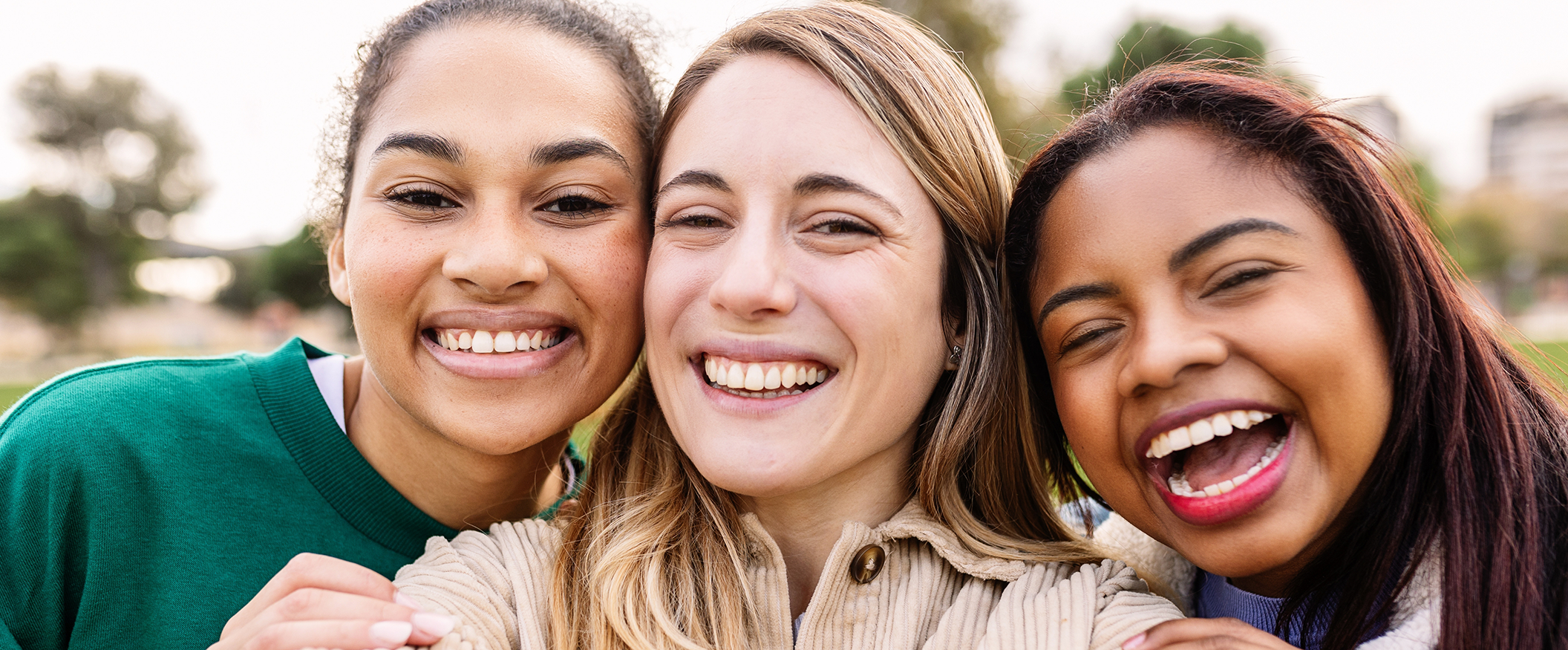 Selfie of three women smiling with dental implants in Tampa